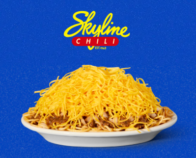 A plate of Cincinnati-style Skyline Chili covered with finely shredded cheddar cheese