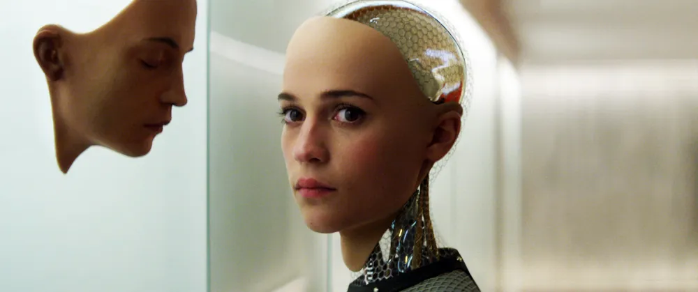 Ava examining a humanlike face in a scene from the film Ex Machina