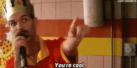 A man wearing a paper crown points toward the camera above the words You're cool